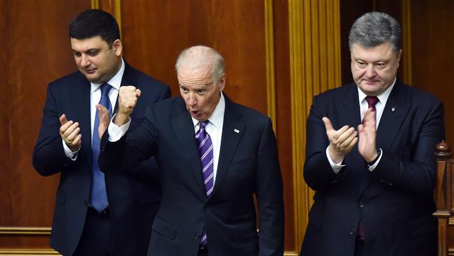 US Vice President Joe Biden gestures next to Ukraine’s President Petro Poroshenko after addressing deputies of the Ukrainian Parliament in Kiev