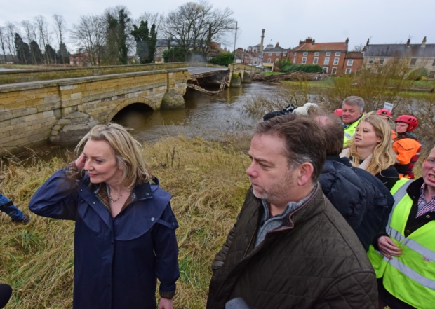 Environment Secretary Elizabeth Truss by Tadcaster's partially collapsed bridge