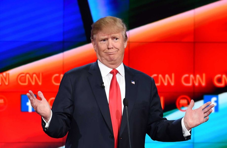 Republican presidential candidate Donald Trump gestures during the Republican presidential debate. A reader says it is Trump not Muslim immigrants who should be monitored by the federal government