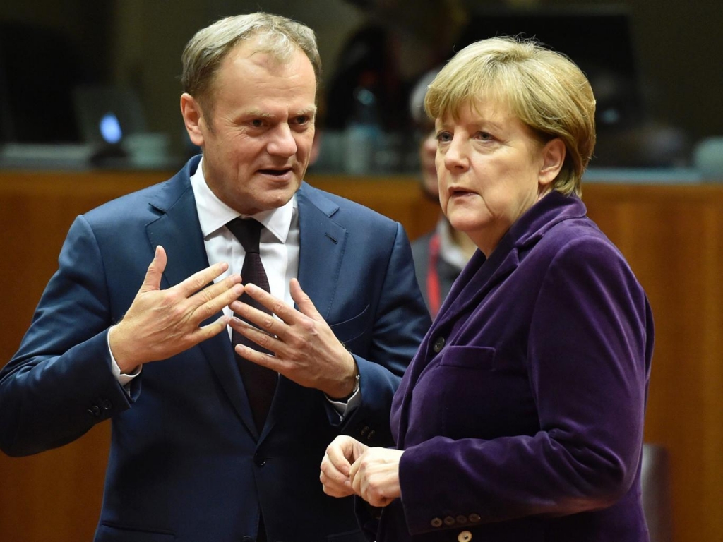 European Council president Donald Tusk left with German Chancellor Angela Merkel at the European Union summit