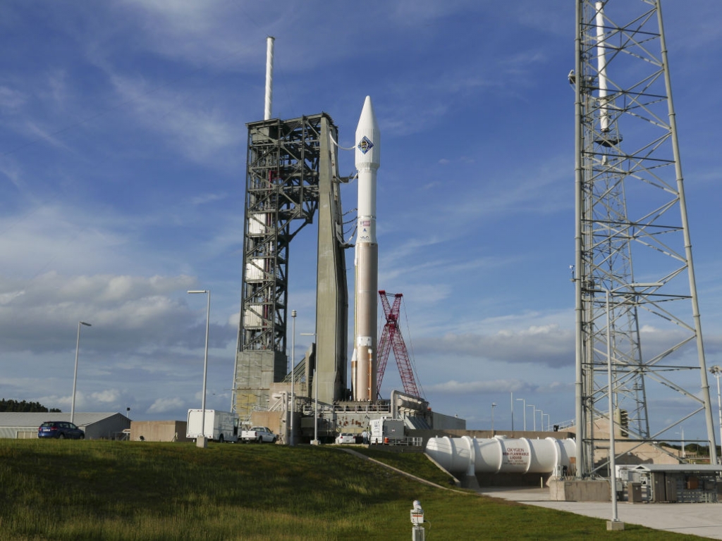 An unmanned Atlas V rocket sits on the launch pad Wednesday Dec. 2 2015 at Cape Canaveral Fla. The rocket is due to lift off early Thursday evening with 7,400 pounds of supplies for the International Space Station