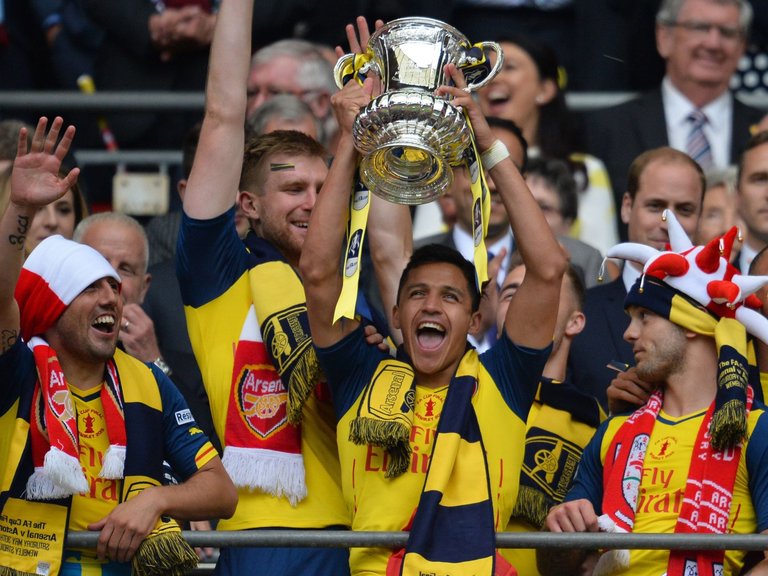 Alexis Sanchez celebrates winning the FA Cup with Arsenal