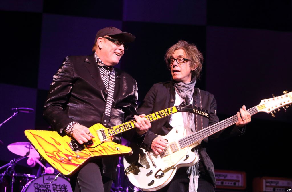 FILE- Rick Nielsen and Tom Petersson of the band Cheap Trick perform in concert at the American Music Theatre in Lancaster Pa