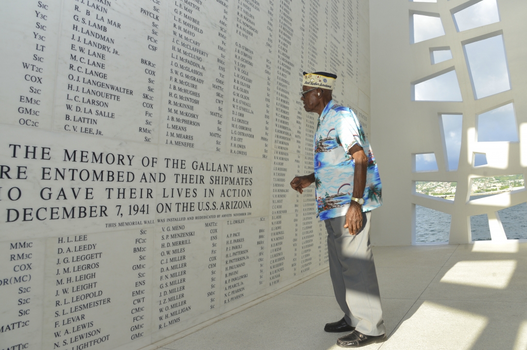 Nelson Mitchell the oldest living African American Pearl Harbor survivor reflects in the shrine room of the USS Arizona Memorial during a Pearl Harbor Survivor World War II Family and Friends Harbor Tour at Joint Base Pearl Harbor Hickam on Dec. 5 20