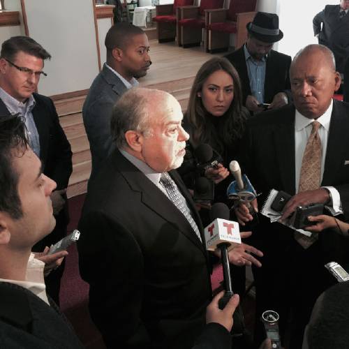 Robbins center attorney for the family Laquan McDonald speaks at a news conference Friday Dec. 11 2015 in Chicago. The family of McDonald a black teenager shot 16 times by a white Chicago police officer stepped forward Friday