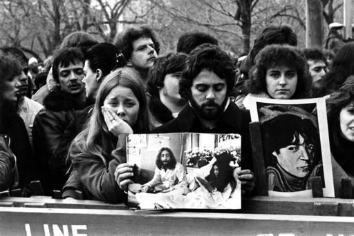 People line up to commemorate John Lennon in Central Park in New York after his death in 1980