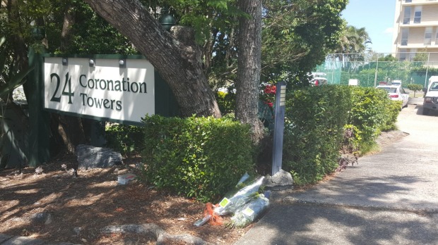 Floral tributes left at the apartment complex in Auchenflower