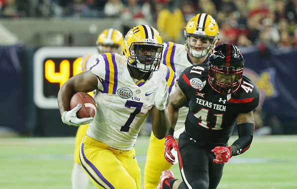 HOUSTON TX- DECEMBER 29 Leonard Fournette #7 of the LSU Tigers runs for a 44-yard touchdown during the first half of their game against the Texas Tech Red Raiders during the Advo Care V100 Texas Bowl at NRG Stadium