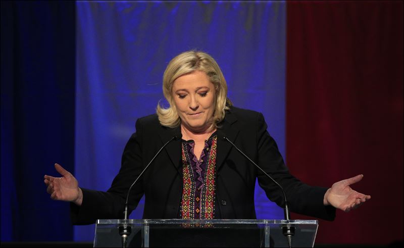 Far Right National Front party leader Marine Le Pen delivers her speech after the results of the second round of the regional elections in Henin-Beaumont northern France