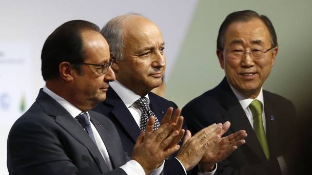 French President Francois Hollande left French foreign minister Laurent Fabius centre and United Nations Secretary General Ban Ki-moon applaud at the COP21