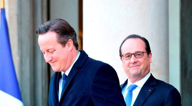 French President Francois Hollande escorts British Prime Minister David Cameron