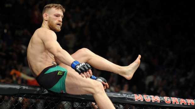 Conor Mc Gregor celebrates his stunning first-round knockout of Jose Aldo