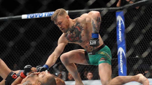 Conor Mc Gregor finishes off Jose Aldo during their UFC featherweight title fight in Las Vegas