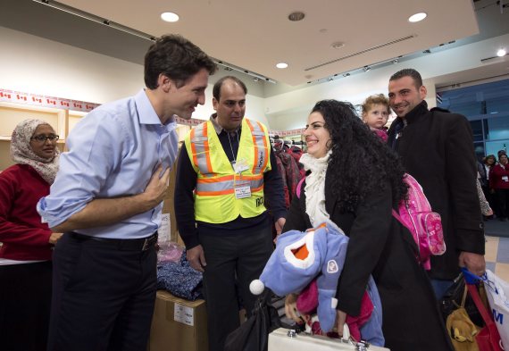 Syrian refugees headed to Canada on first planeload