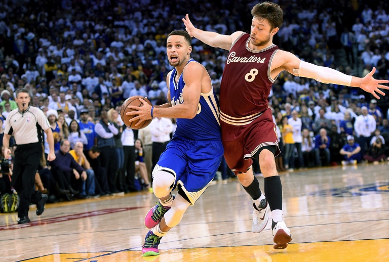 Getty  AFP  Thearon W. Henderson Stephen Curry of the Golden State Warriors drives to the basket on Matthew Dellavedova of the Cleveland Cavaliers during their NBA game at ORACLE Arena in Oakland California