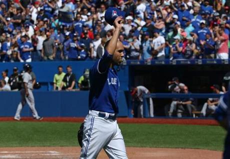 TORONTO CANADA- AUGUST 3 David Price #14 of the Toronto Blue Jays tips his cap to a standing ovation from fans at the end of the eighth inning during MLB game action against the Minnesota Twins