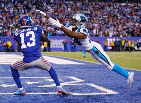 EAST RUTHERFORD NJ- DECEMBER 20 Odell Beckham #13 of the New York Giants scores a game tying touchdown against Josh Norman #24 of the Carolina Panthers in the fourth Quarter during their game at Met Life Stadium