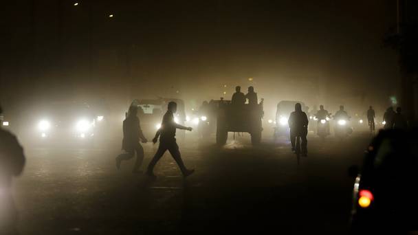 Gloom on a busy road in New Delhi India