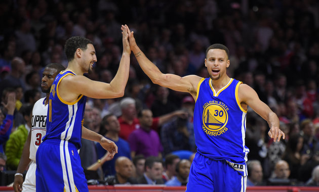 Golden State Warriors guard Stephen Curry right celebrates with guard Klay Thompson left in the second half of last night's game against the Los Angeles Clippers. The Warriors won 124-117