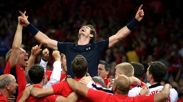 Great Britain's Andy Murray is mobbed by his team-mates after winning the Davis Cup