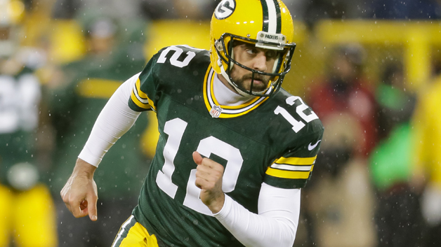 GREEN BAY WI- NOVEMBER 26 Quarterback Aaron Rodgers #12 of the Green Bay Packers warms up prior to the NFL game against the Chicago Bears at Lambeau Field