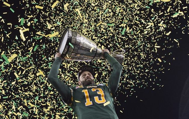Edmonton Eskimos quarterback Mike Reilly hoists the Grey Cup after his teams win over the Ottawa Redblacks during the 103rd Grey Cup in Winnipeg Man. Sunday Nov. 29 2015. THE CANADIAN PRESS  Nathan Denette