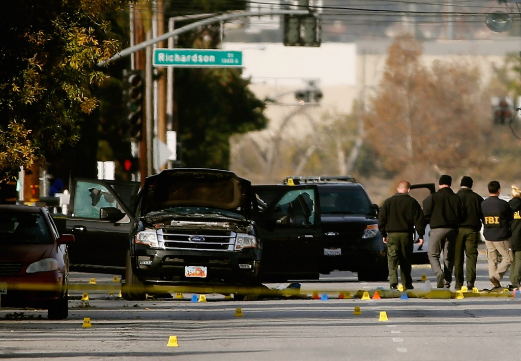 FBI agents and local law enforcement examine the crime scene where suspects in the Inland Regional Center were killed on Dec. 3 2015 in San Bernardino