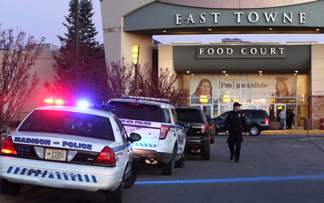 Authorities respond to reports of shots fired at East Towne Mall in Madison Wis. Saturday Dec. 19 2015. Madison police said one person was shot in the