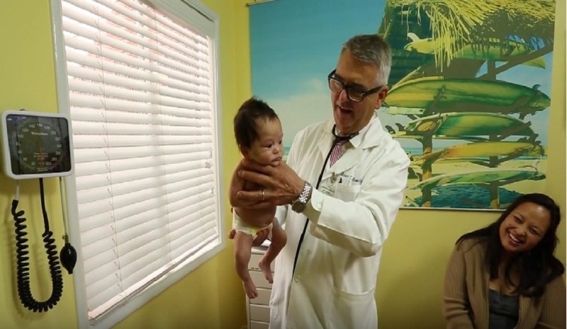 Pediatrician calming a baby