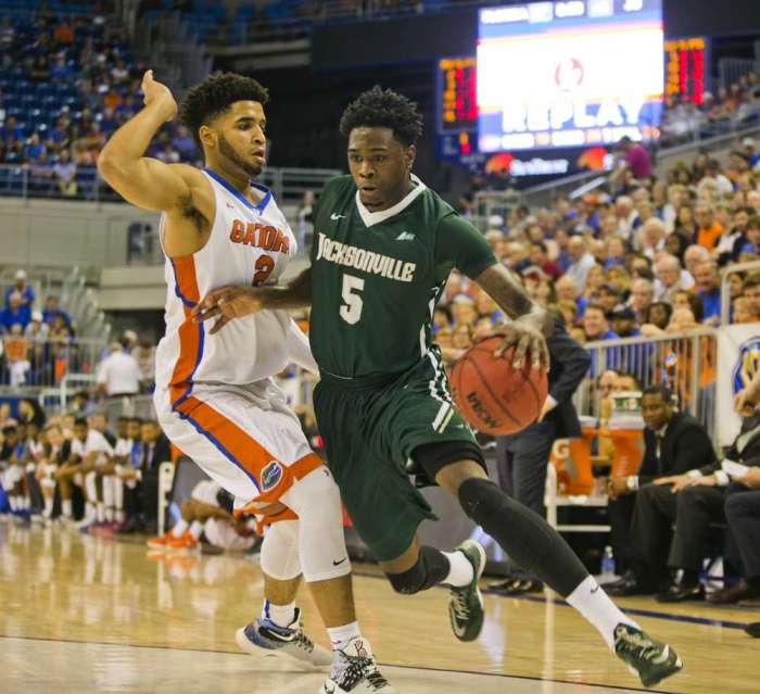 Cyndi Chambers For the Times Union Jacksonville University's Darius Dawkins drives to the basket against Florida's Brandone Francis Ramirez on Tuesday night in Gainesville. Jacksonville Times-Union