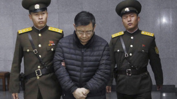 Hard labour for life Canadian pastor Hyeon Soo Lim is escorted to his sentencing in Pyongyang on Wednesday