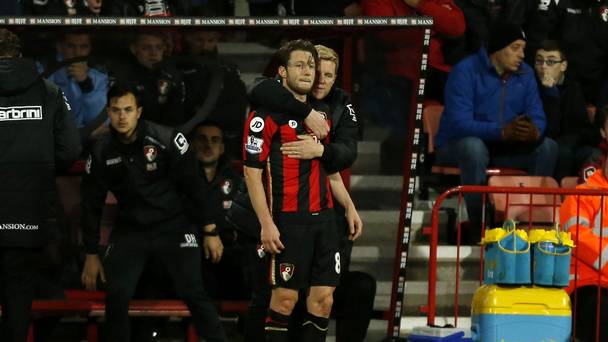 Harry Arter left is embraced by Bournemouth boss Eddie Howe