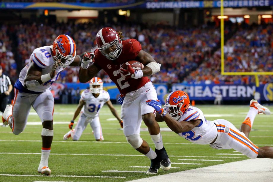 ATLANTA GA- DECEMBER 5 Running back Derrick Henry #2 of the Alabama Crimson Tide carries the ball against linebacker Jarrad Davis #40 of the Florida Gators and defensive back Keanu Neal #42 of the Florida Gators in the third quarter during the SEC Cham