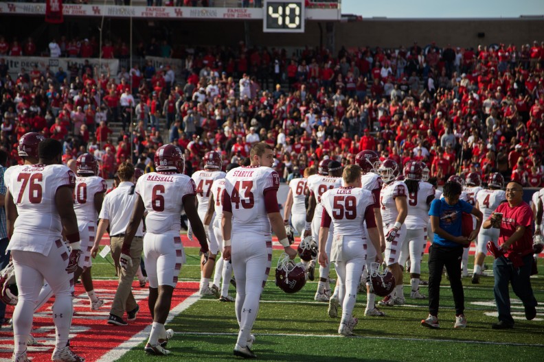 The football team walks off John O'Quinn Field at TDECU Stadium Saturday after Houston defeated the Owls 24-13. | Jenny Kerrigan TTN