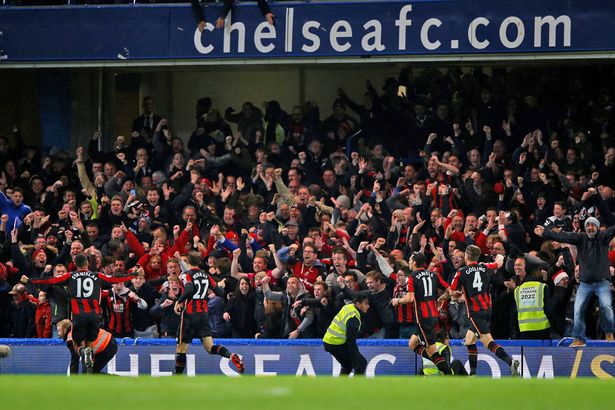 Glenn Murray celebrates scoring the first goal with his team mates in front of the supporters