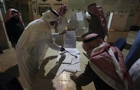 Saudi electoral workers prepare to count ballots after the country's municipal elections in Riyadh Saudi Arabia Saturday Dec. 12 2015. Women across Saudi Arabia marked a historic milestone on Saturday both voting and running as candidates in gov