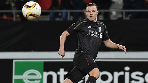 In charge Brad Smith watches the ball off the boot