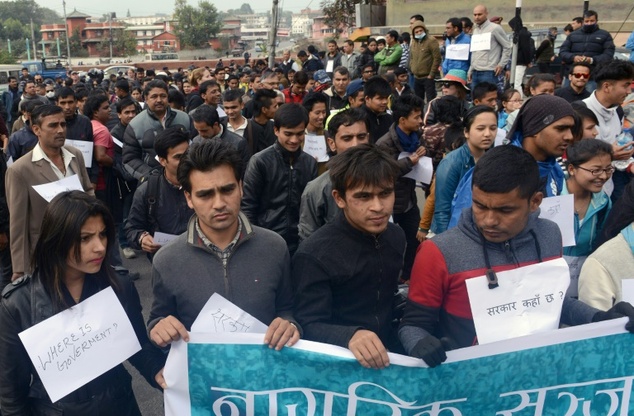 Nepalese activists carry placards during a protest rally against the ongoing dispute between Nepal and India in Kathmandu