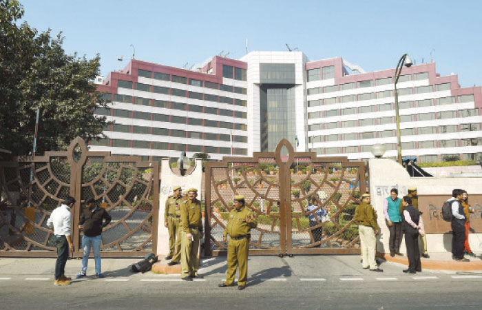 Indian police stand guard outside the Delhi Secretariat in New Delhi India on Tuesday. — AFP