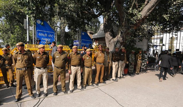 Indian security personnel stand guard outside the Patiala House court