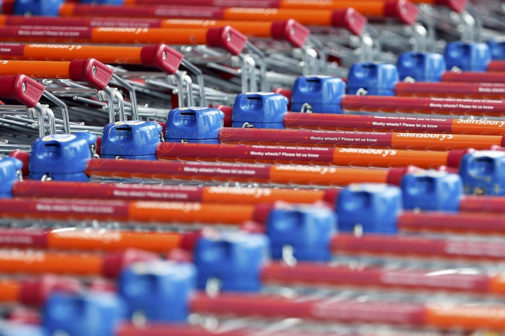 Shopping trolleys are seen parked at a Sainsbury's store