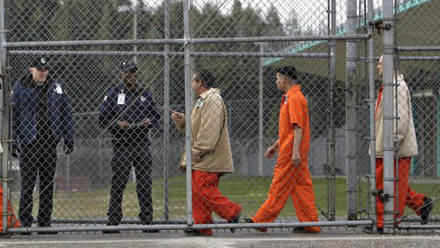 Inmates walking past corrections officers at the Washington Corrections Center in Shelton Wash. Feb. 17 2011