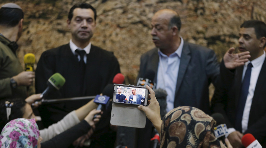 Hussein Abu Khudair, the father of murdered Palestinian teenager Mohammed Abu Khudair talks to the media at the Jerusalem District Court