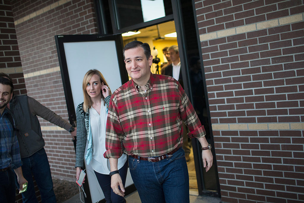 Republican presidential candidate Sen. Ted Cruz leaves a campaign event at Cross Roads Shooting Sports gun shop and range