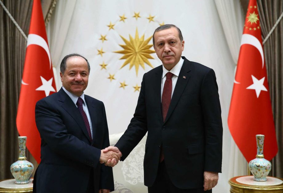 Turkish President Recep Tayyip Erdogan right and President of Iraq'a northern Kurdish region Massoud Barzani shake hands before a meeting in Ankara Turkey Wednesday Dec. 9 2015. Turkish Prime Minister Ahmet Davutoglu on Wednesday defended his coun