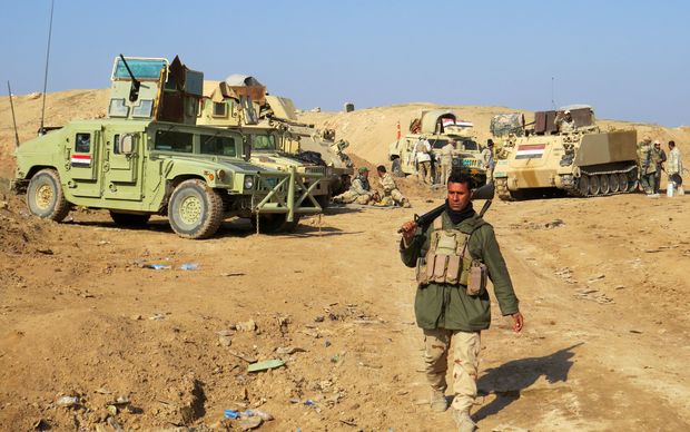 Iraqi pro-government tribal forces hold a position of Ramadi on December 16