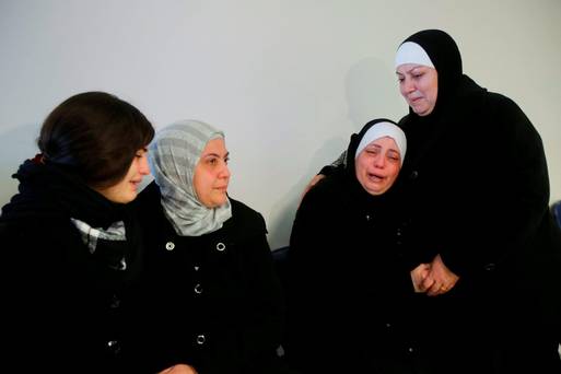 Relatives of Palestinian Maher Aljabi 56 whom medics said was shot and killed by Israeli troops on Saturday mourn during his funeral in the West Bank city of Nablus