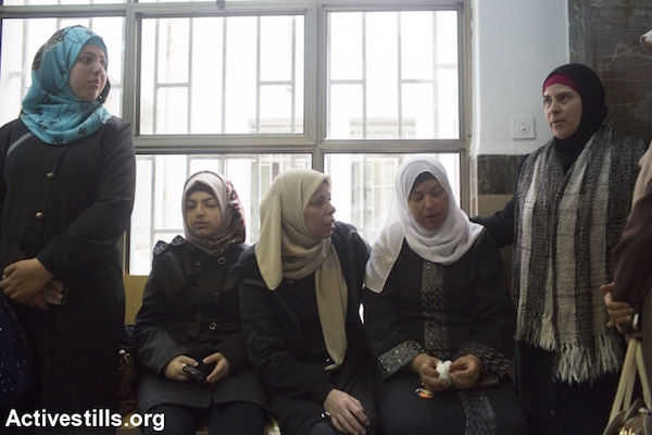 Suha, the mother of Palestinian teenager Muhammad Abu Khdeir who was murdered last year sits in the district court in Jerusalem