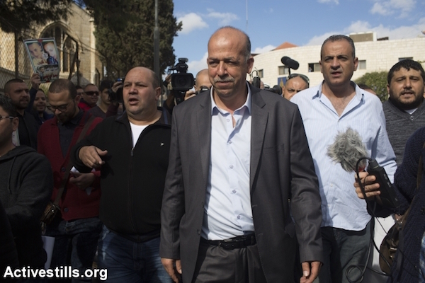 Hussein the father of Palestinian teenager Muhammad Abu Khdeir who was murdered last year walks outside the district court in Jerusalem