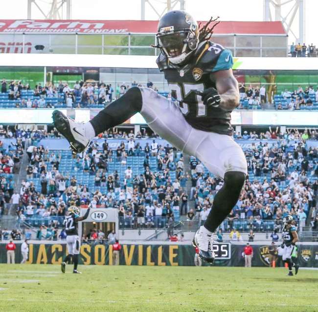 Jaguars strong safety Johnathan Cyprien celebrates after intercepting a pass intended for Colts tight end Coby Fleener during the second half at Ever Bank Field on Sunday